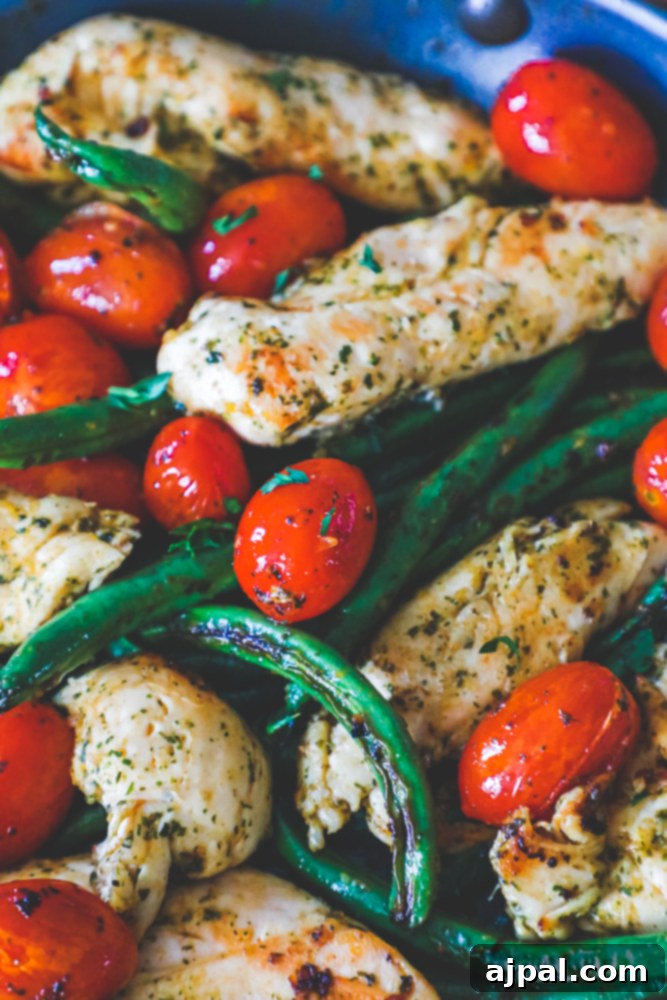 One Pan Tuscan Chicken and Vegetables 8 chicken, green beans, and tomatoes in a pan