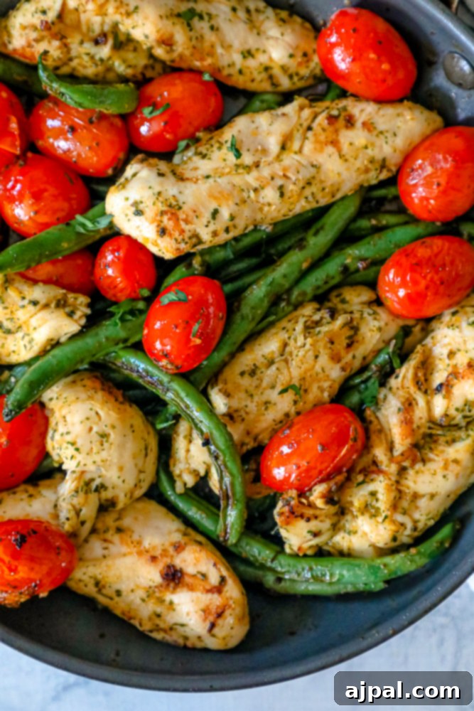 One Pan Tuscan Chicken and Vegetables 4 chicken, green beans, and tomatoes in a pan