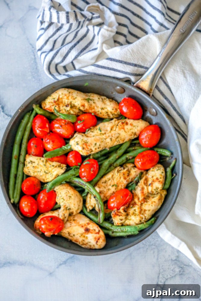 One Pan Tuscan Chicken and Vegetables 5 chicken, green beans, and tomatoes in a pan