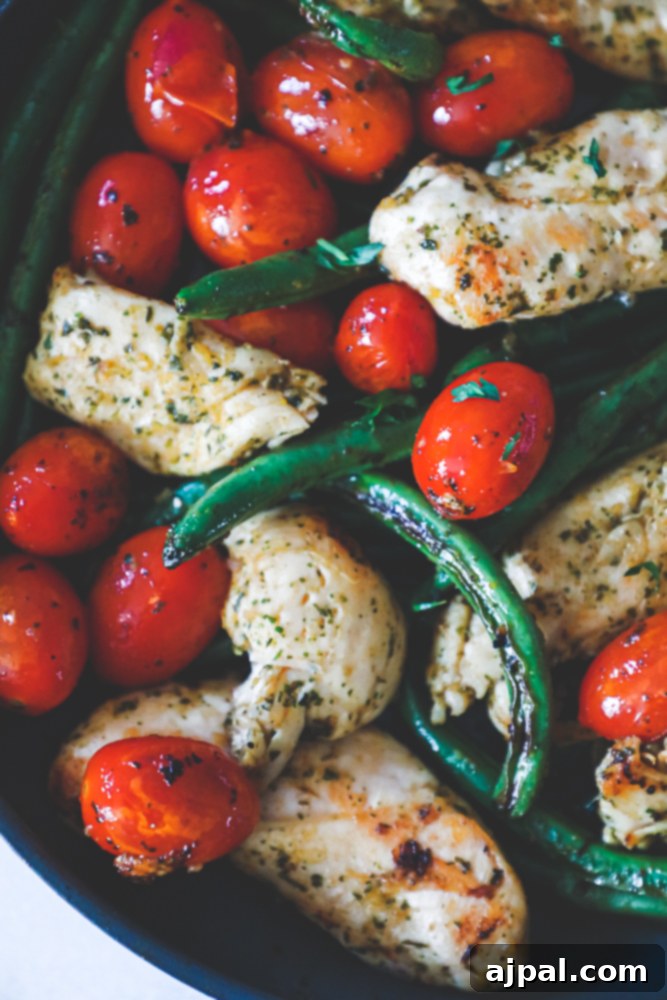 One Pan Tuscan Chicken and Vegetables 6 chicken, green beans, and tomatoes in a pan