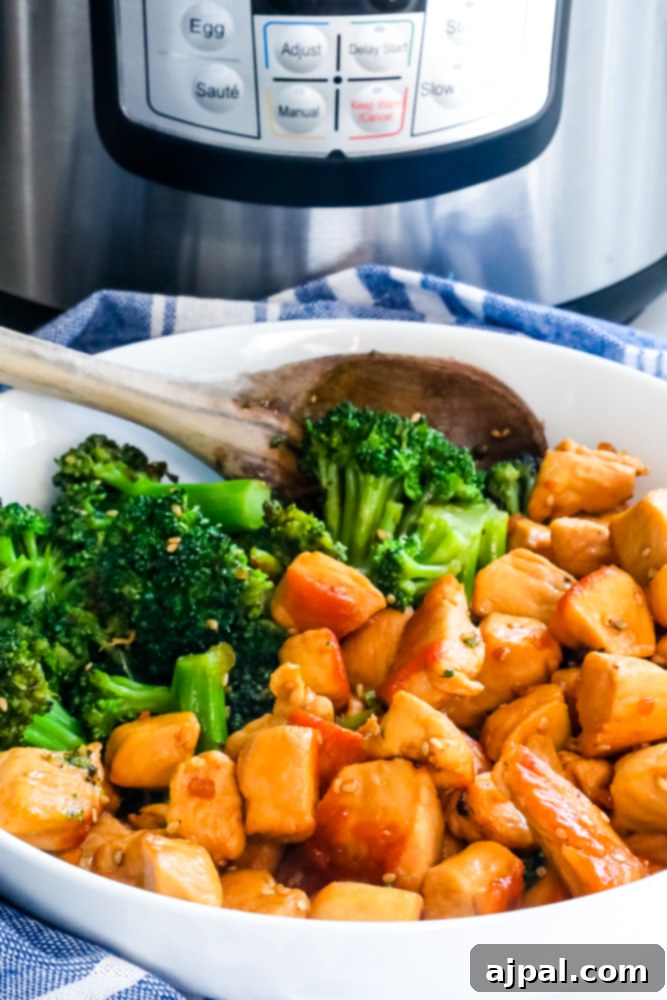 A mouth-watering image of Instant Pot Teriyaki Chicken with broccoli, garnished and ready to be enjoyed.
