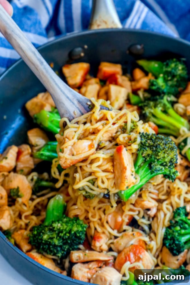 Speedy Teriyaki Chicken Noodle Stir-fry 6 A serving of easy chicken teriyaki noodles stir fry with crisp broccoli in a skillet, garnished with fresh green onions.