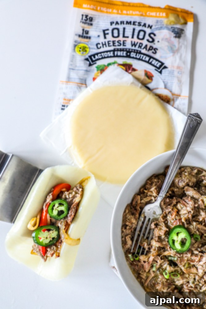 Zesty Green Chile Pork Carnitas 7 A savory bowl of Green Chile Pork Carnitas, ready to be served with cheese wraps.