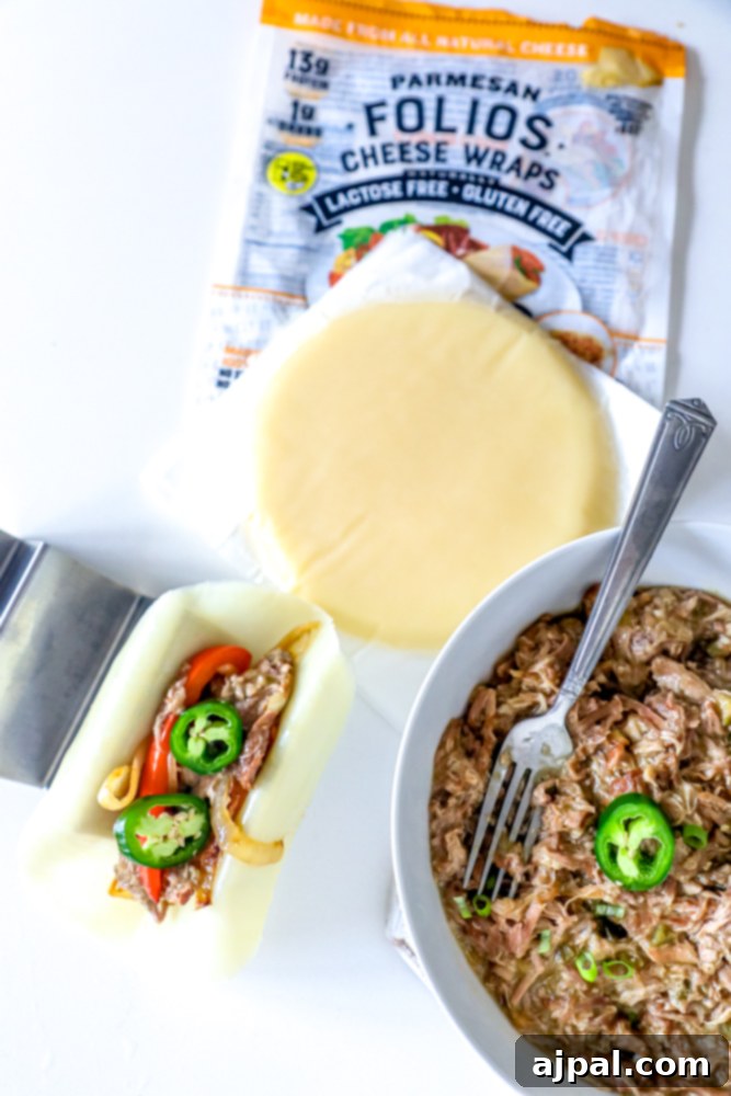 Zesty Green Chile Pork Carnitas 10 A bowl of Green Chile Pork Carnitas perfectly paired with a package of cheese wraps, ideal for a keto-friendly meal.