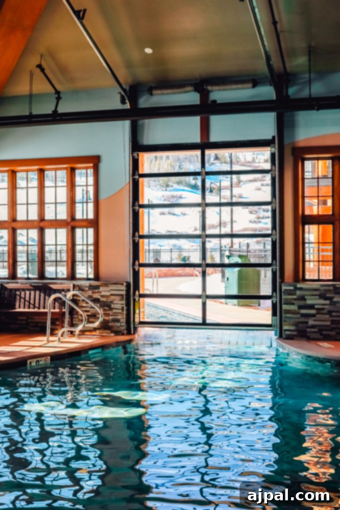 Ranahan By Welk Resorts: Breckenridge Colorado 3 A serene indoor swimming pool at The Ranahan By Welk Resorts in Breckenridge, Colorado, featuring large windows that invite natural light and offer views of the surrounding landscape.