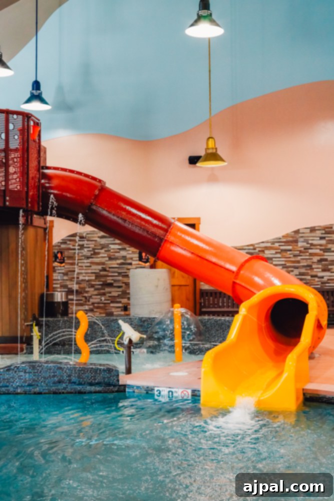 Ranahan By Welk Resorts: Breckenridge Colorado 6 An exciting indoor pool area with a thrilling water slide at The Ranahan By Welk Resorts in Breckenridge, Colorado, perfect for family fun.