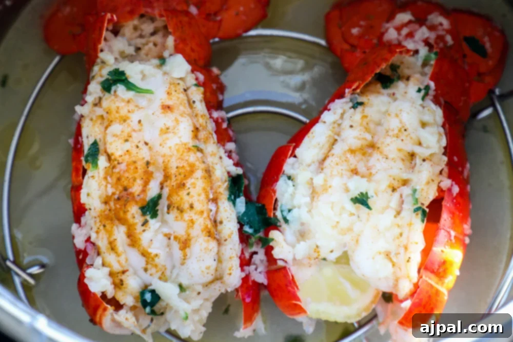 Two perfectly cooked Instant Pot lobster tails resting after pressure cooking.
