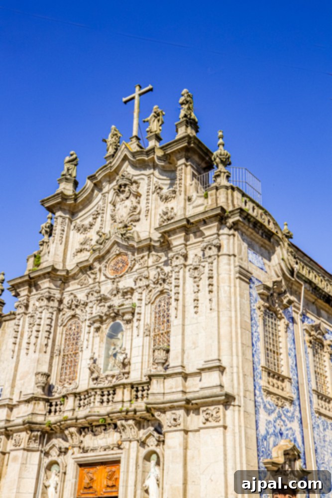 Crafting the Perfect Port and Tonic 13 An ornate building in Porto, Portugal, featuring intricate architectural details and topped with a cross.