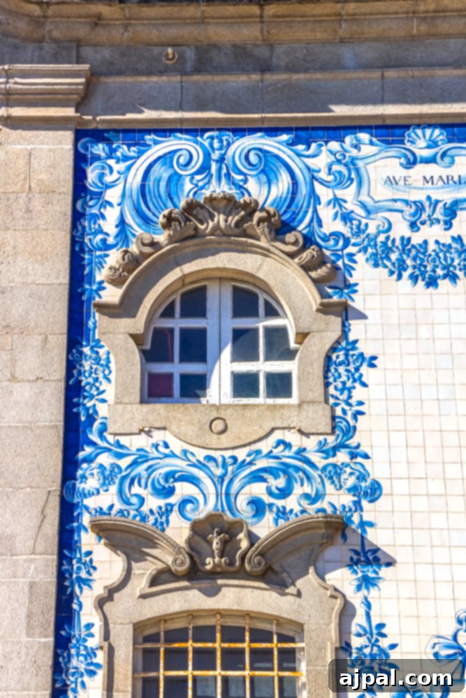 Crafting the Perfect Port and Tonic 16 A charming blue and white tiled building in Porto, Portugal, featuring a rustic window, embodying the city's distinctive architectural style.