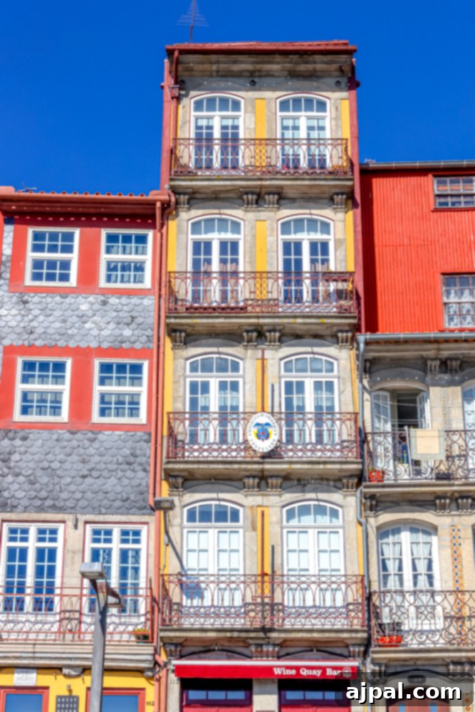 Crafting the Perfect Port and Tonic 17 A vibrant red building in Porto, Portugal, standing out with its striking color amidst the city's charming architecture.