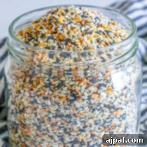Ultimate Everything Bagel Seasoning Blend 7 A jar of The Best Everything Bagel Seasoning Mix Recipe on a table.