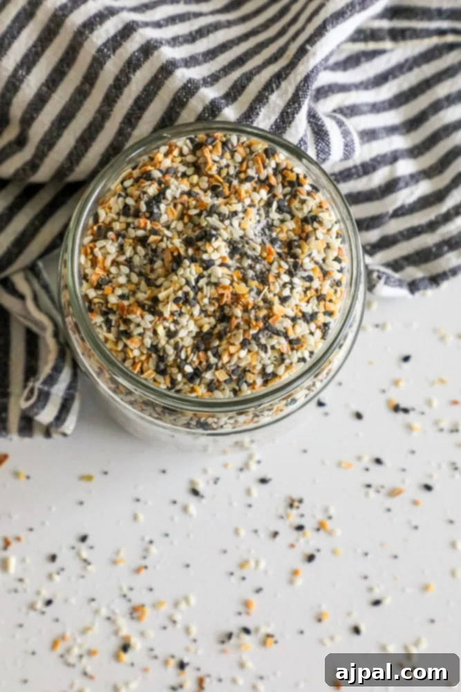 Ultimate Everything Bagel Seasoning Blend 3 A table with a bowl of Everything Bagel Mix, ready to be used.