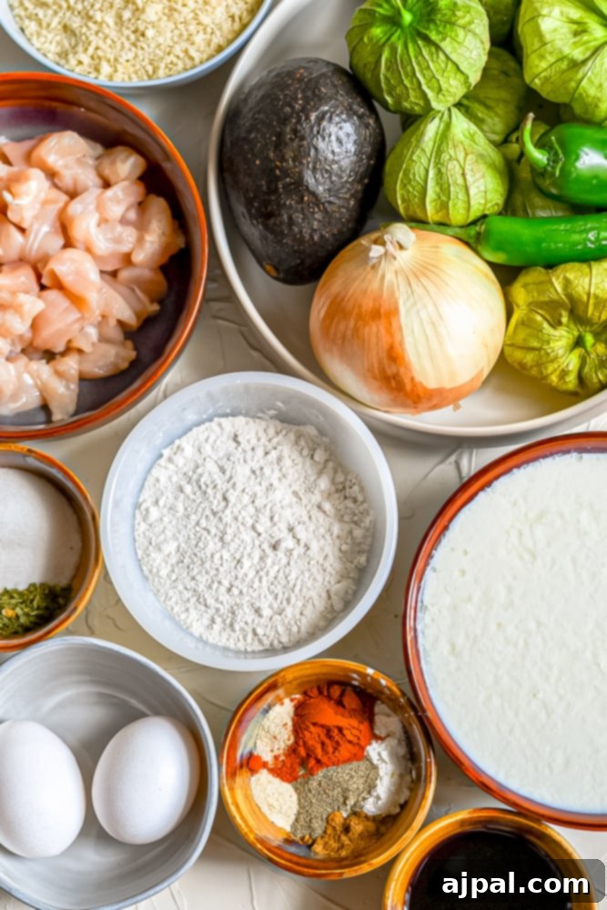 A collection of fresh ingredients laid out for preparing easy Fried Chicken Tacos, including herbs, spices, and sauces.