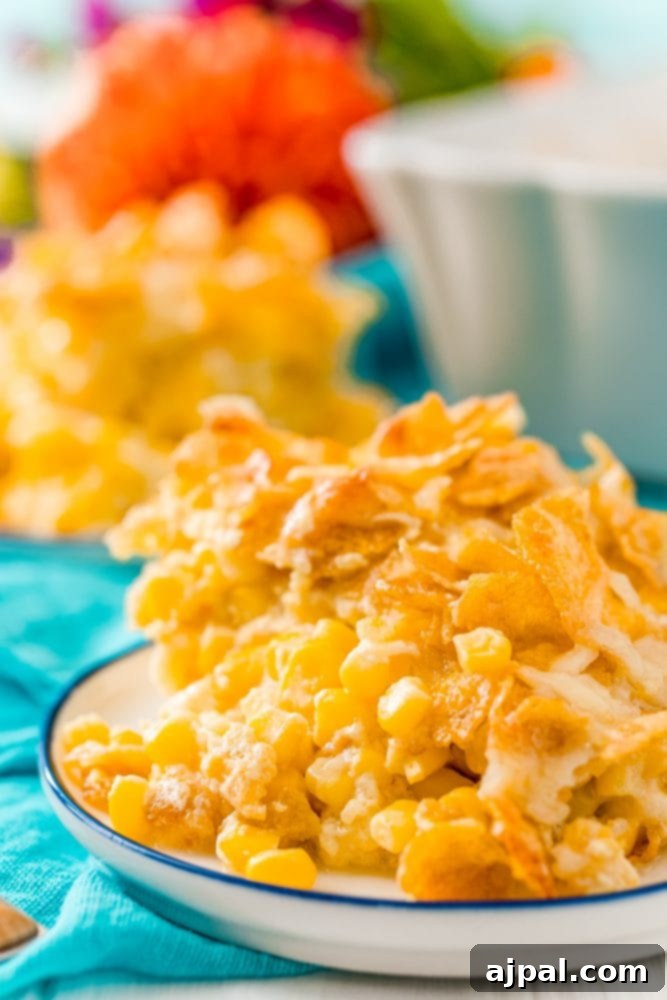 Golden Scalloped Corn Bake 2 scalloped corn with cornflakes in a white plate