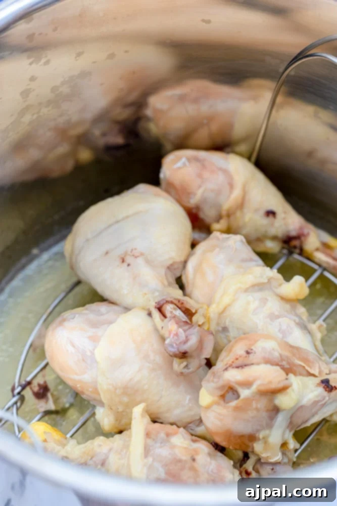 Cooked chicken legs in an Instant Pot, showing the tender result after pressure cooking.