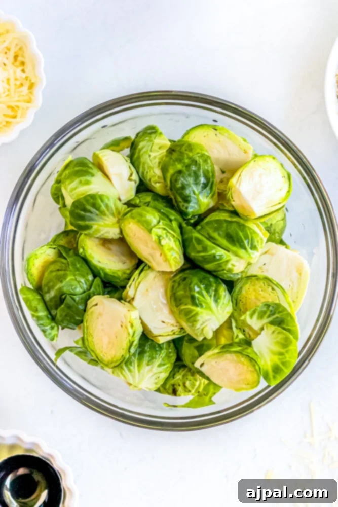 Crispy Keto Air Fryer Brussels Sprouts 6 bowl of brussels sprouts with olive oil and seasonings