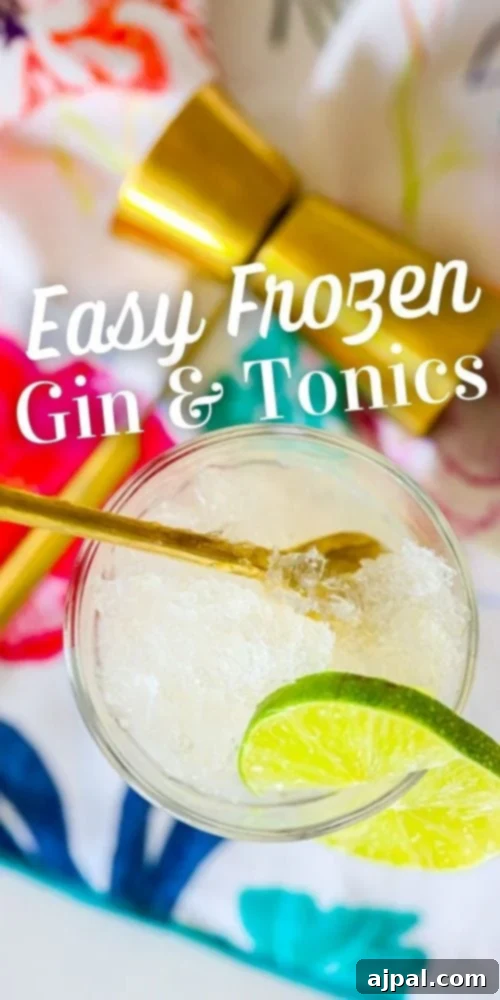 A close-up picture of a glass filled with a delicious frozen gin and tonic slush cocktail, garnished with a vibrant lime slice, with the descriptive text 'Frozen Gin and Tonic Cocktail' overlaid.