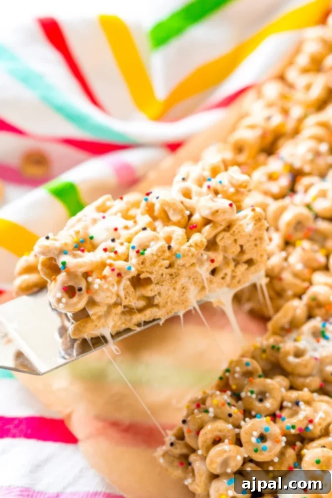 No Bake Cheerios Treats Recipe with sprinkles on top, neatly arranged in a square pattern.