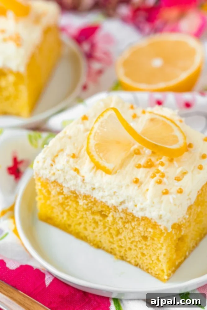 Effortless Lemon Jello Poke Cake 12 Lemon Jello Poke Cake Recipe on a plate.