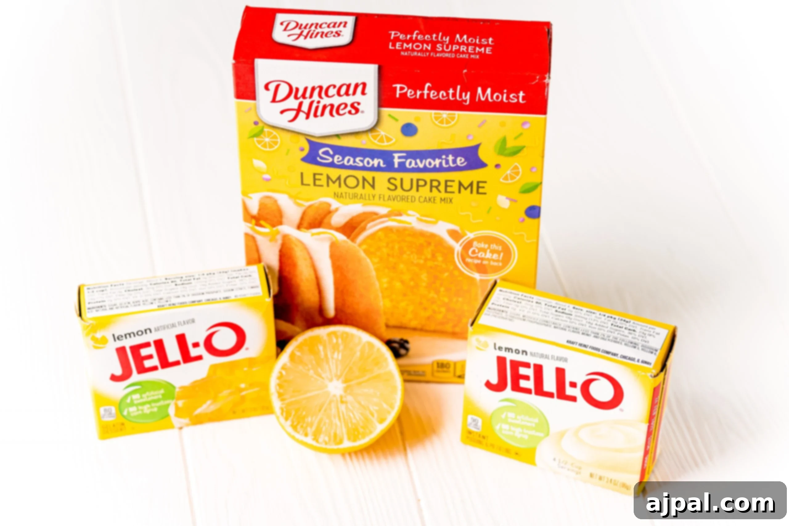 Effortless Lemon Jello Poke Cake 3 A box of lemon jello next to another box in a Lemon Jello Poke Cake Recipe.