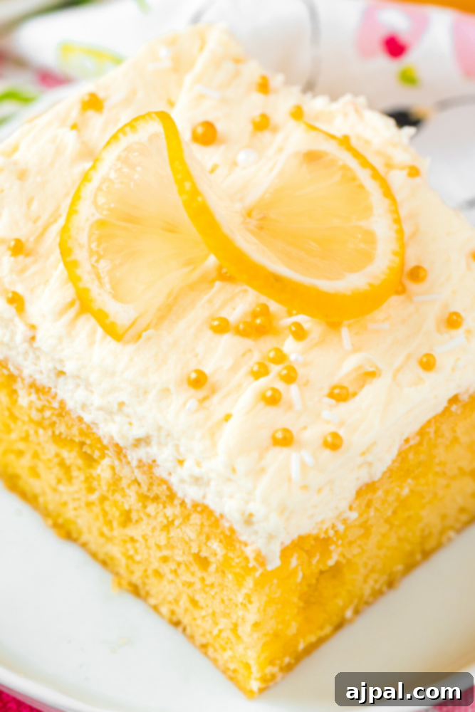 Effortless Lemon Jello Poke Cake 9 A slice of lemon Jello poke cake on a plate.