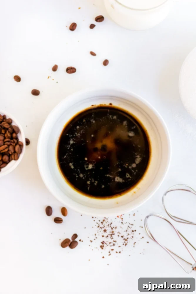 A bowl with instant coffee and sweetener, ready to be whipped.
