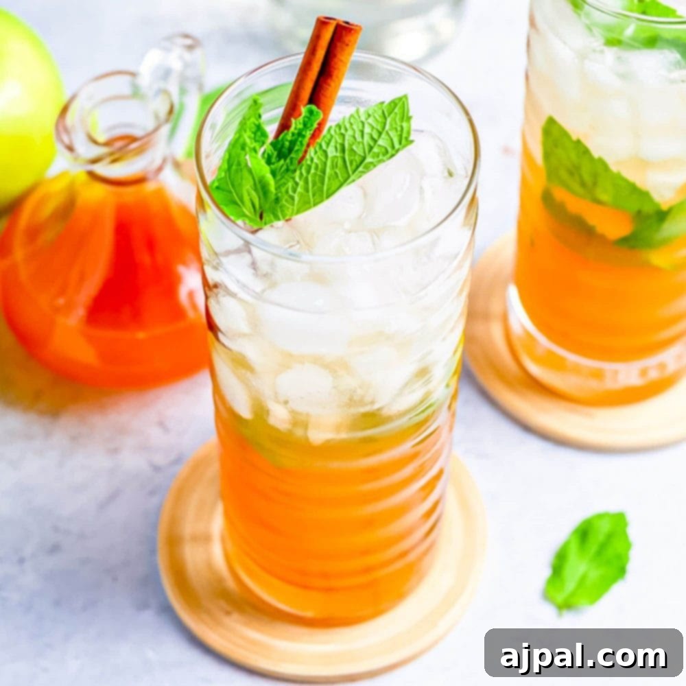 Apple Mojitos Cocktail Recipe with mint leaves and apple slices, perfect for fall.