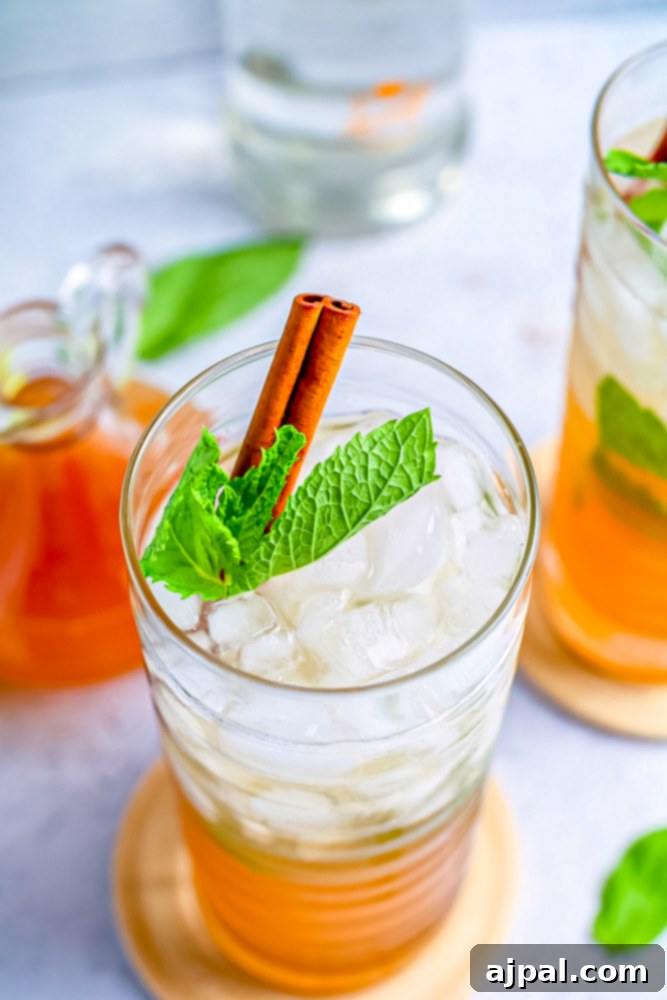 Iced tea with mint leaves, a refreshing drink similar to a mojito.