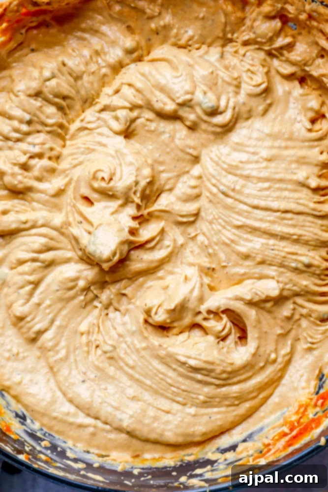 Easy Instant Pot Pumpkin Cinnamon Rolls 17 frosting whipped up close