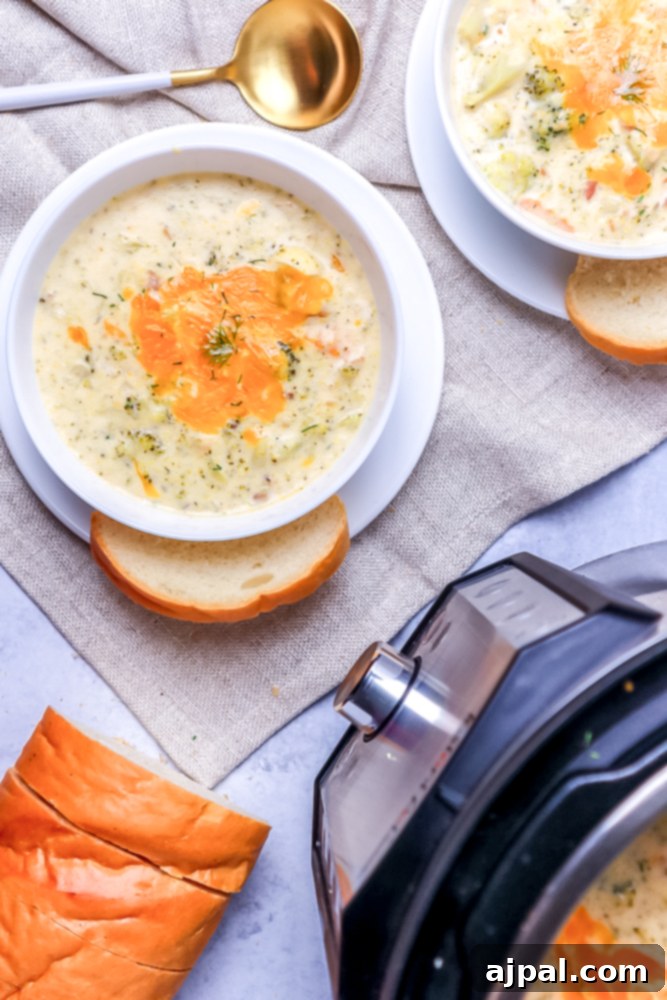 Creamy Instant Pot Keto Broccoli Cheddar Soup 3 Two steaming bowls of keto broccoli cheddar soup artfully placed in front of an Instant Pot, invitingly presenting a delicious low-carb meal.