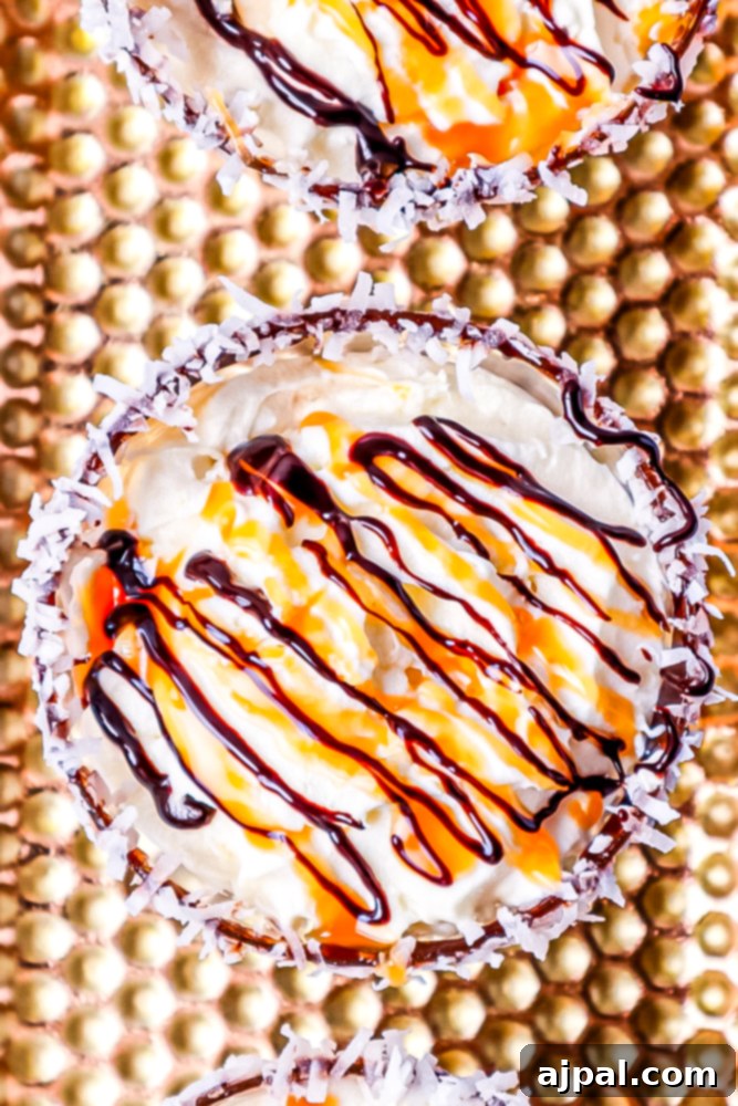 Samoa Martini Made Simple 2 A decadent Samoa Martini garnished with whipped cream, chocolate sauce, and caramel drizzle, featuring a chocolate and coconut flake rim.
