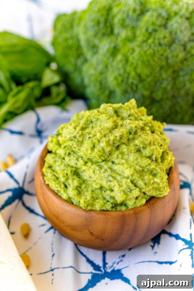 Easy and Delicious Broccoli Pesto 4 Green pesto in a wooden bowl, ready to be enjoyed.