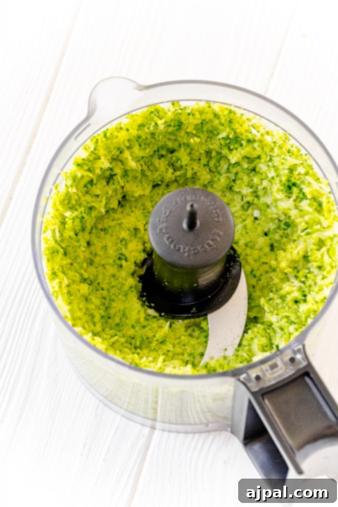 Easy and Delicious Broccoli Pesto 7 A simple broccoli pesto being made using a food processor.