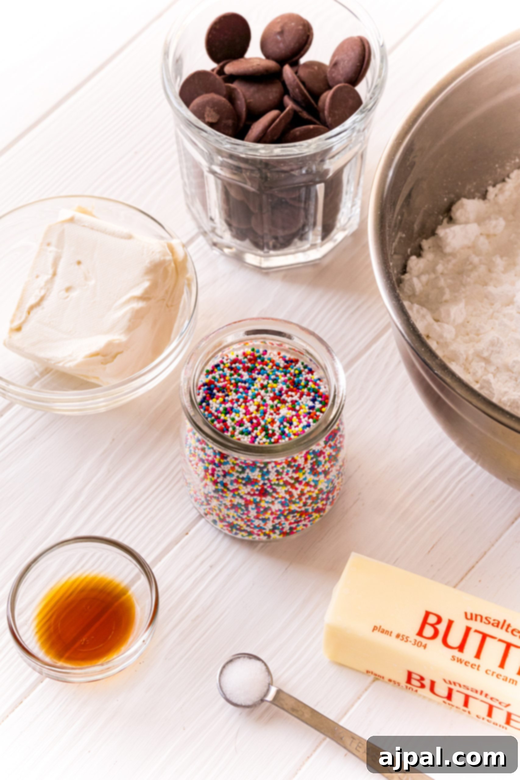 Ingredients for buttercream candies laid out on a white table.