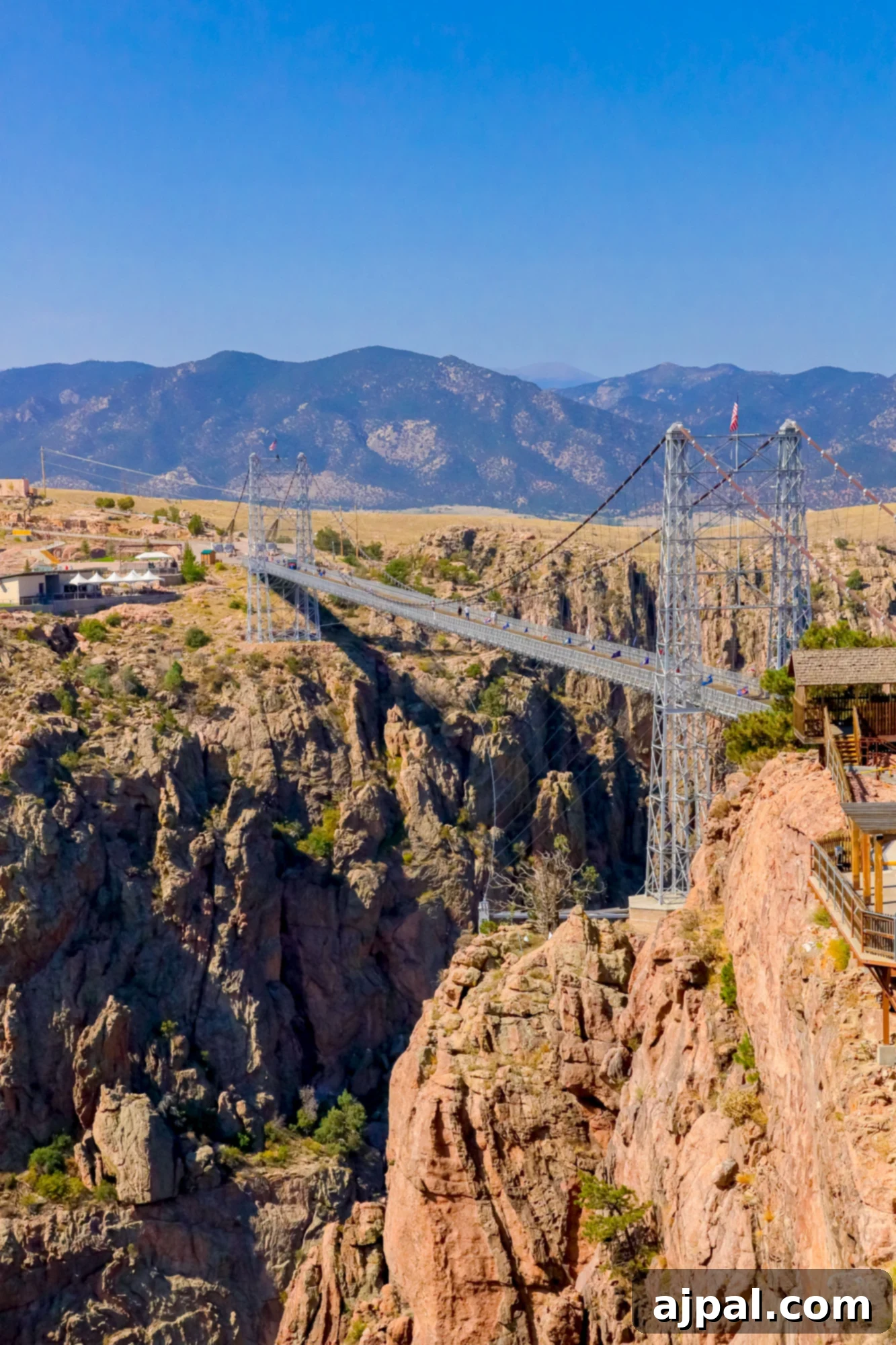 The breathtaking Royal Gorge Bridge, suspended high above a dramatic canyon, offering panoramic views of Colorado's rugged beauty.