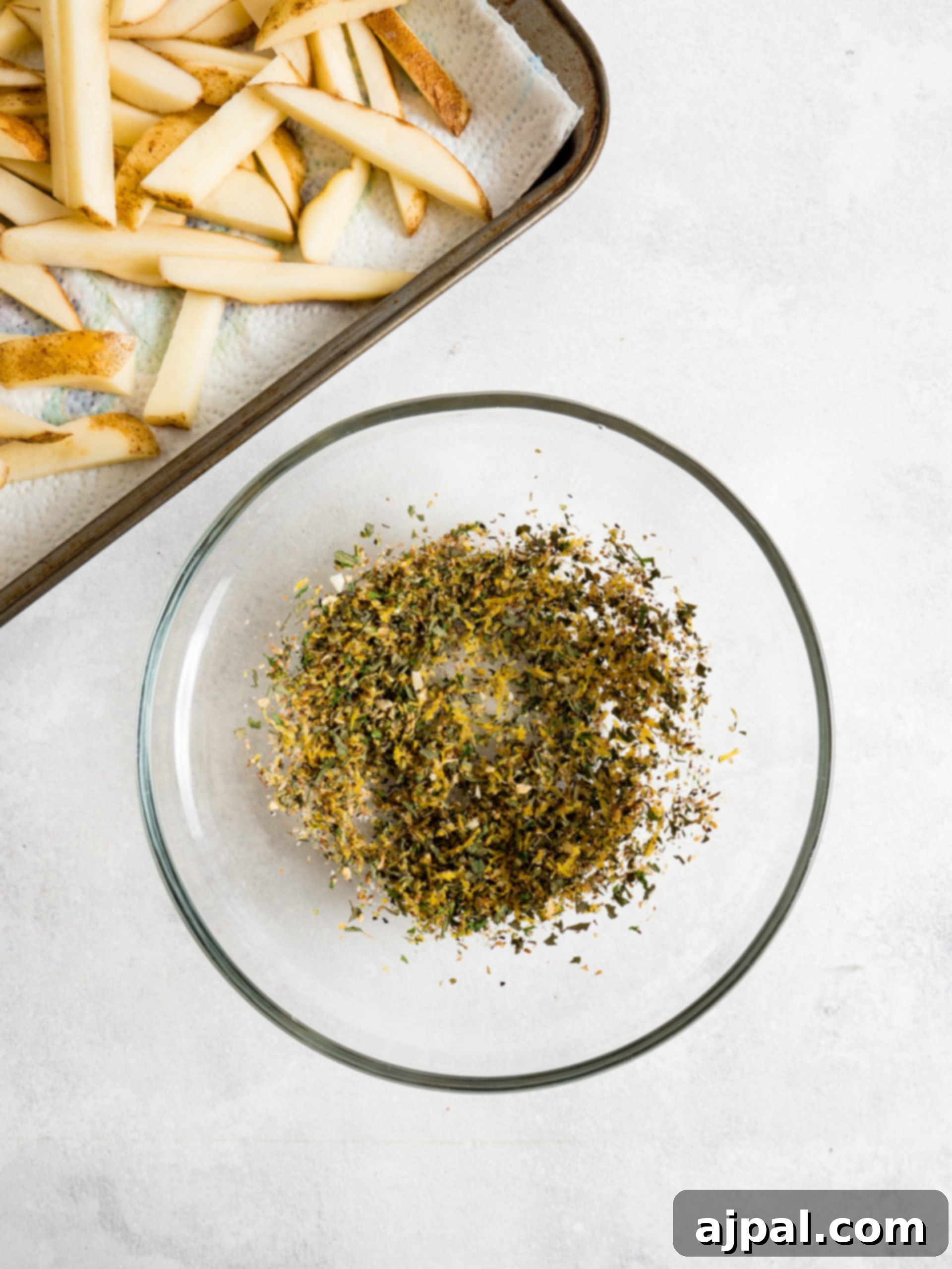 Bowl of lemon pepper seasoning, ready for use.