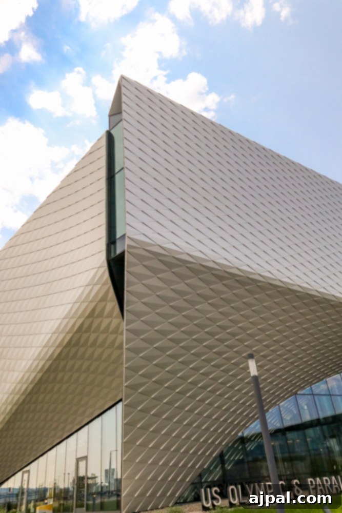 The distinctive metal roof and modern architecture of the US Olympic & Paralympic Museum in Colorado Springs.