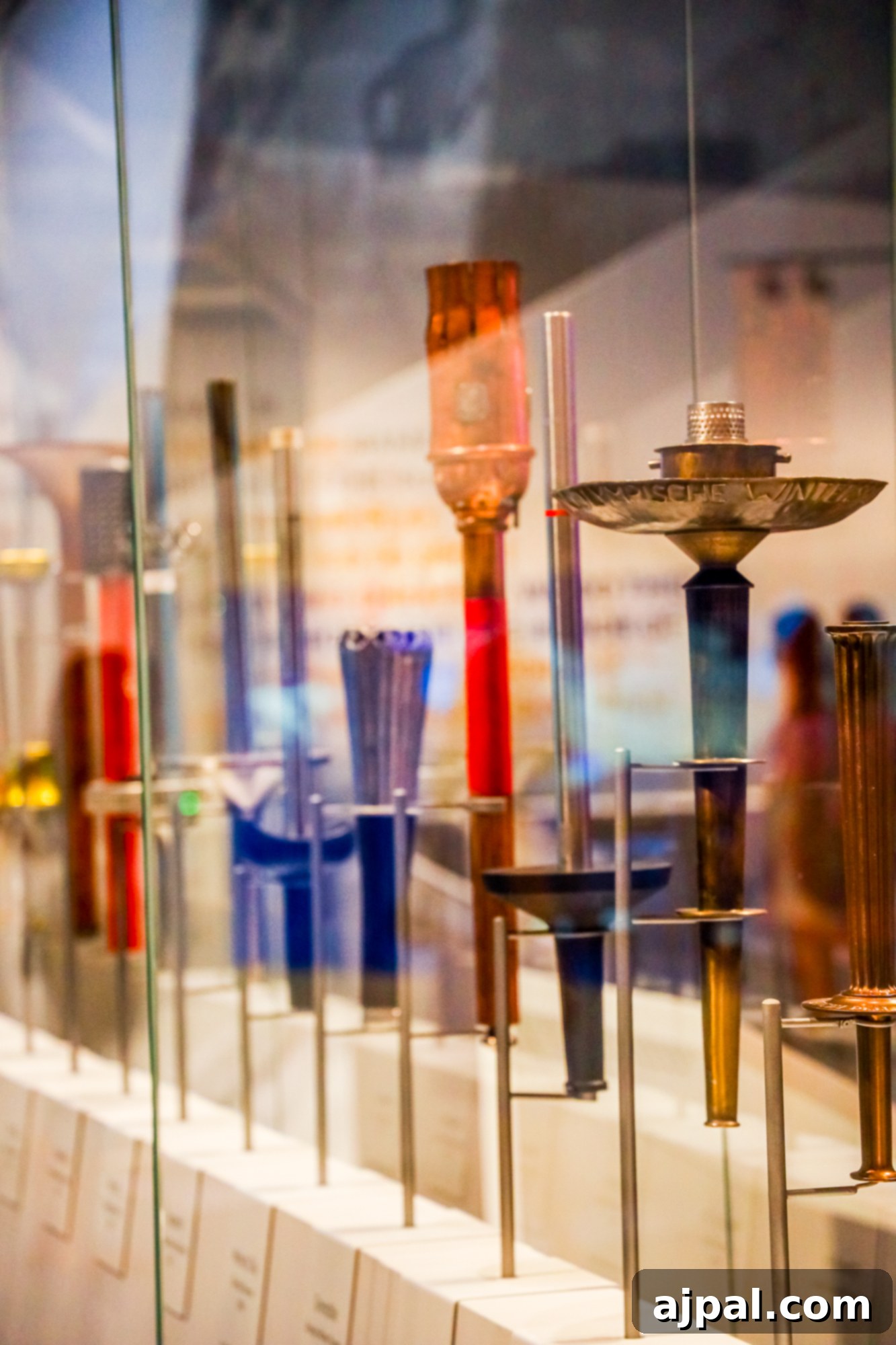 A display of historic Olympic flames in a glass case at the US Olympic & Paralympic Museum.