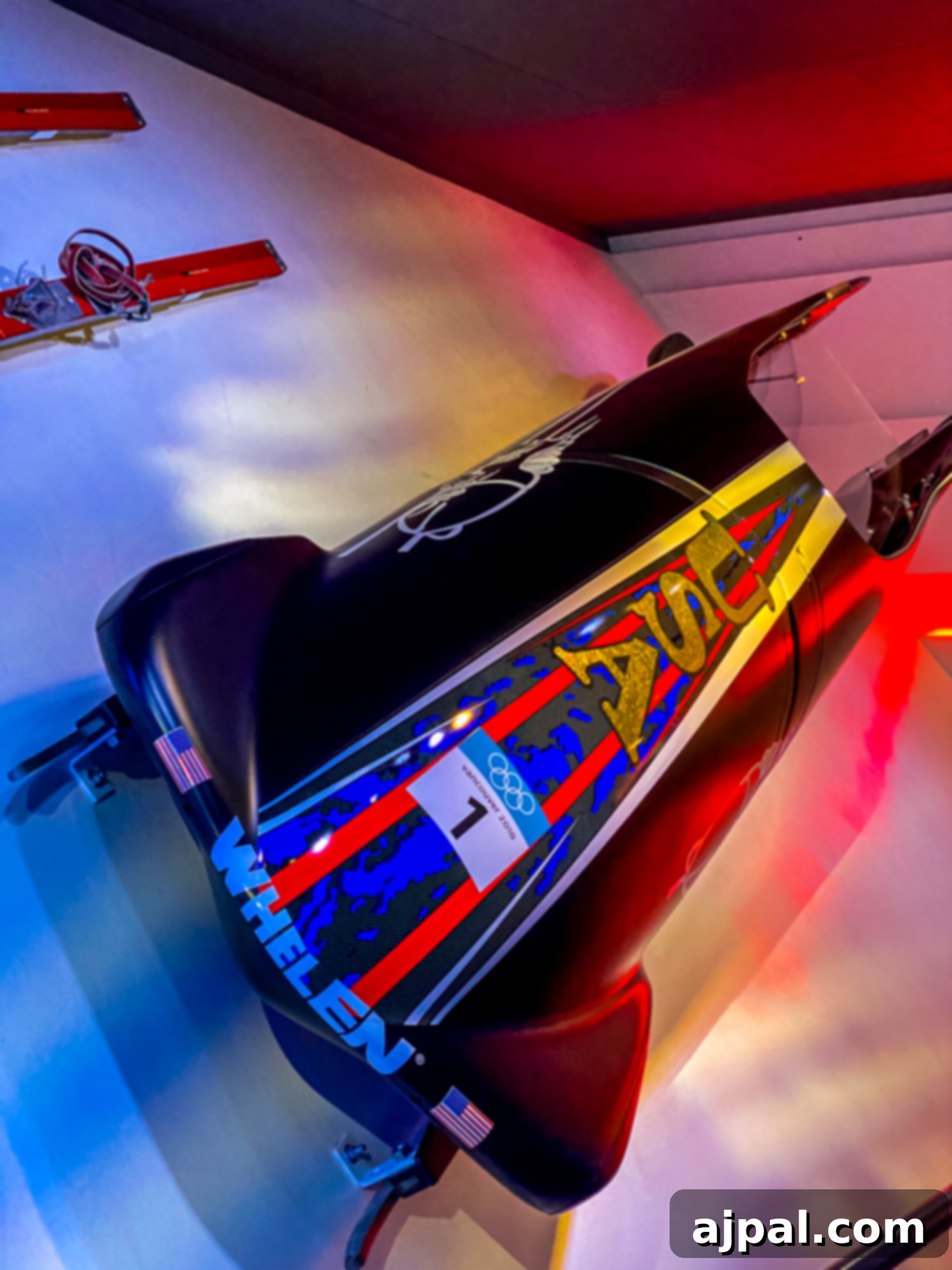 Historic skis on display in the US Olympic & Paralympic Museum, showcasing winter sports history.