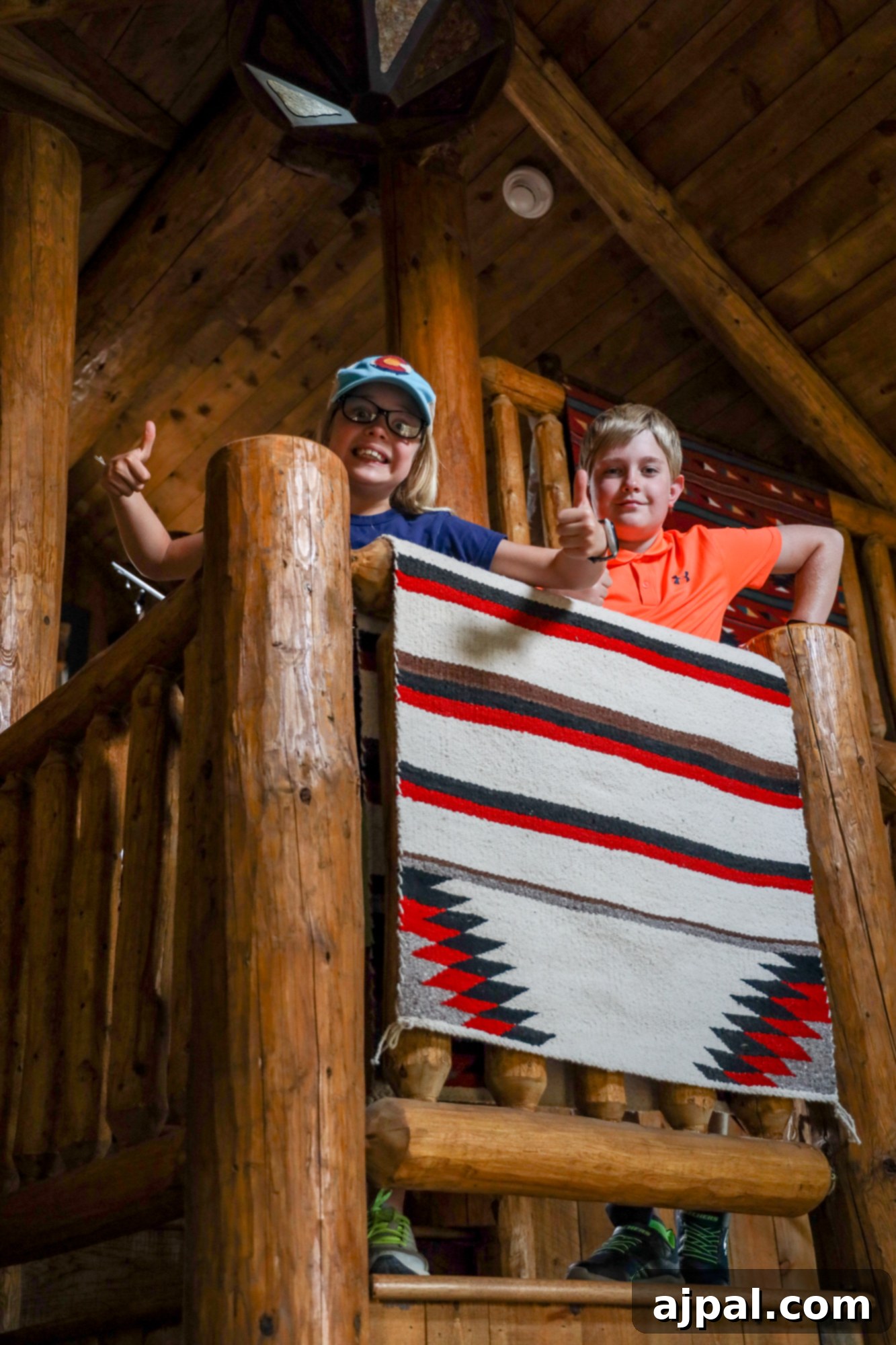 Children enjoying the cozy interior of a cabin at The Broadmoor Cloud Camp.