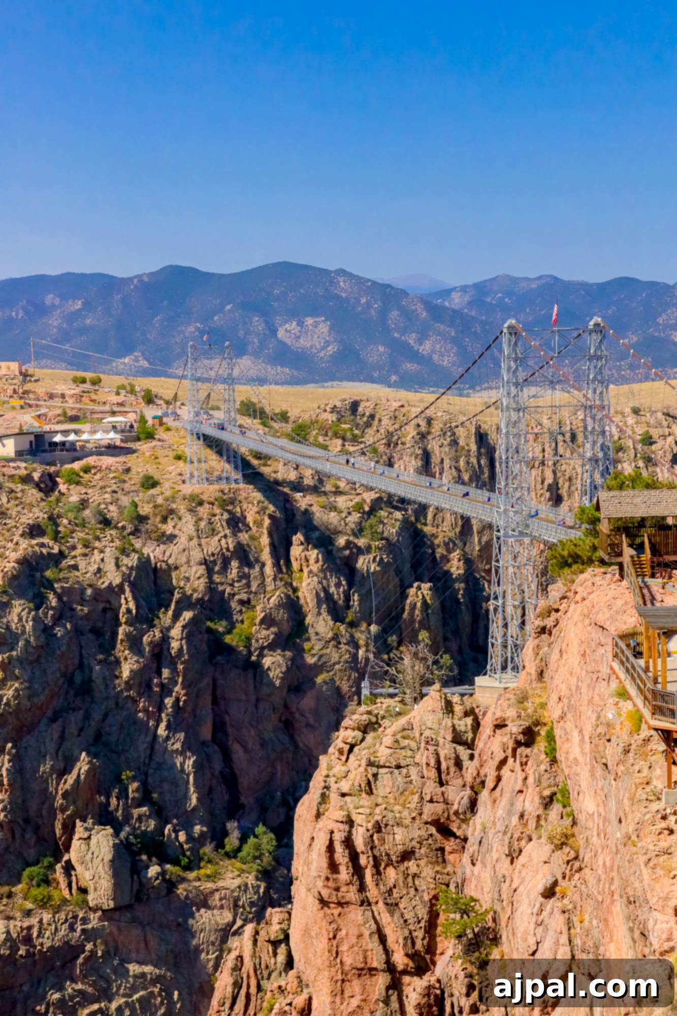 A stunning view of the suspension bridge spanning the vast Royal Gorge canyon.