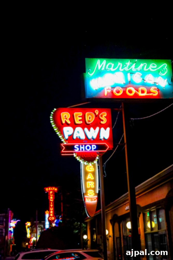 A captivating row of colorful neon signs creating a vibrant street scene.