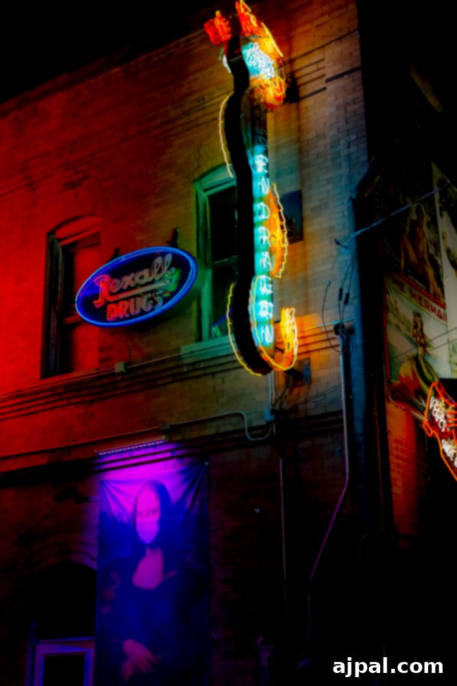 A classic neon sign adorning the side of a building, characteristic of Neon Alley.