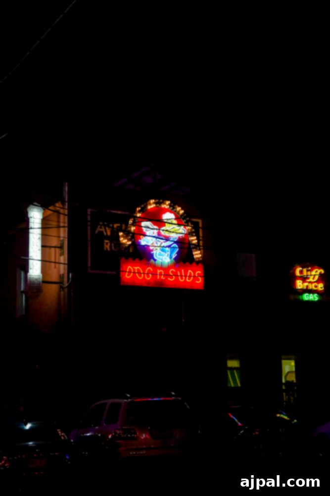 A glowing neon sign against the night sky, captured during an evening stroll through Neon Alley.