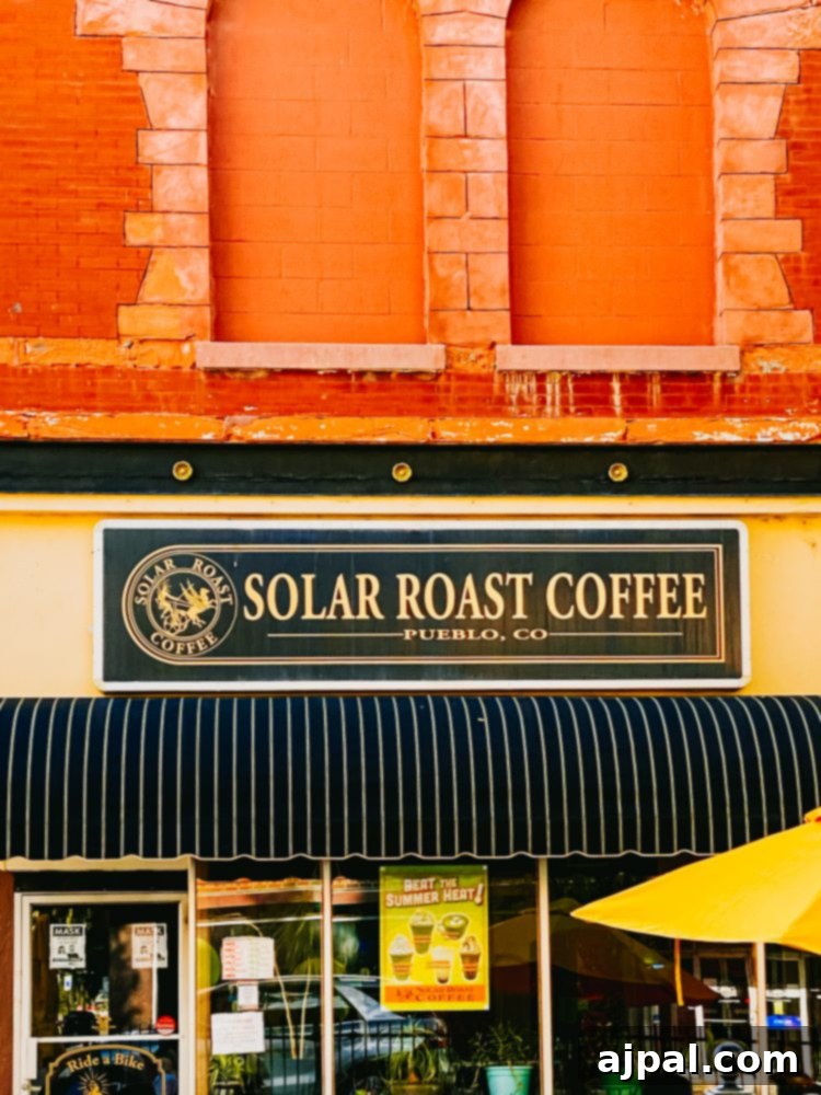 Solar Roast Coffee, a distinctive coffee shop on the corner of a charming brick building in Pueblo.