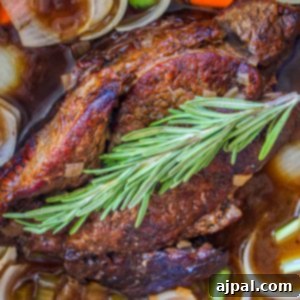 pot roast in a pan with herbs