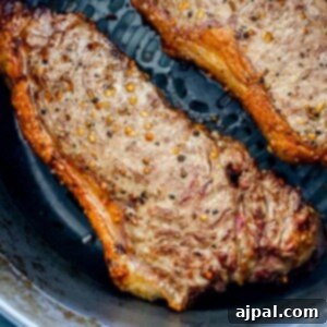 Master Your Air Fryer Steaks 12 picture of steaks in an air fryer basket