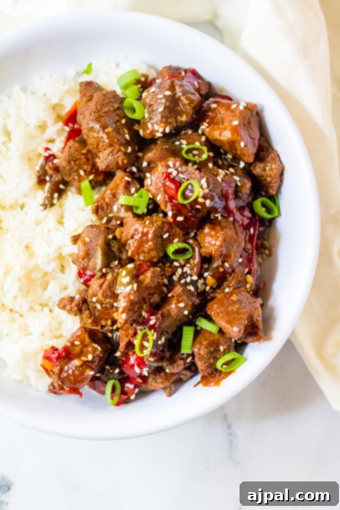 Quick & Flavorful Instant Pot Korean Beef 8 picture of korean beef in a bowl with scallions and rice