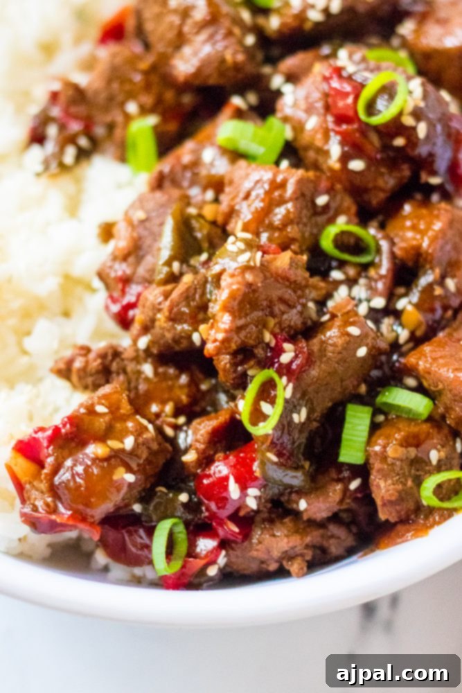 Quick & Flavorful Instant Pot Korean Beef 3 picture of korean beef in a bowl with scallions and rice, garnished with sesame seeds