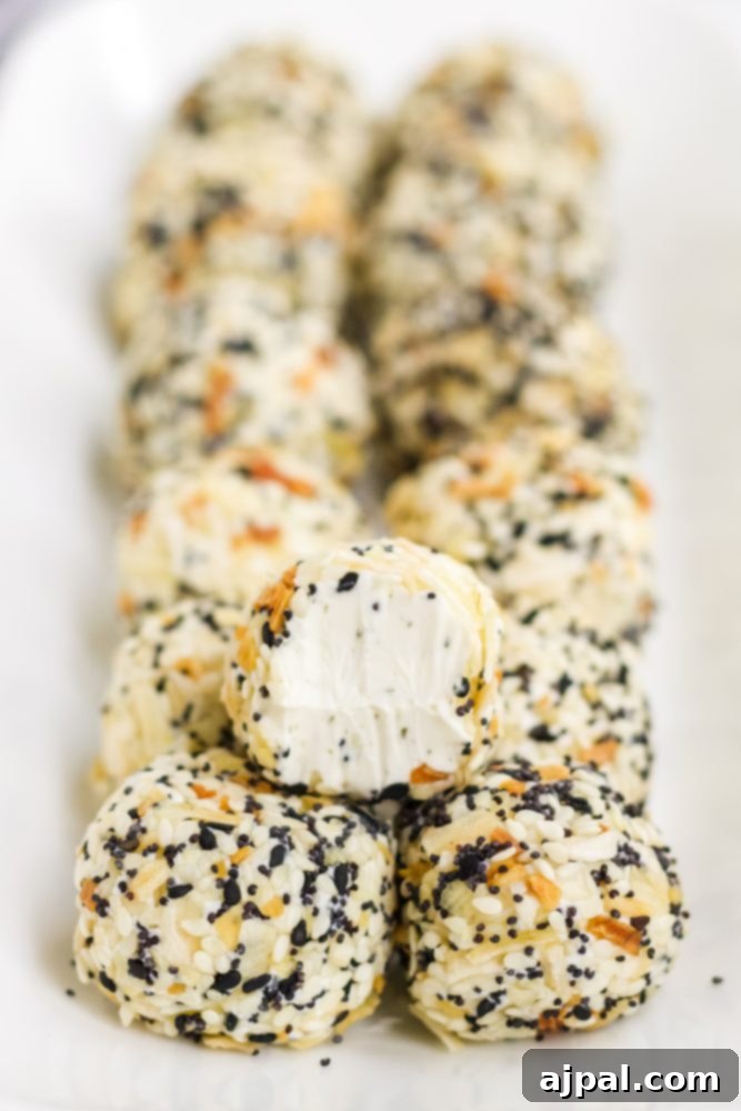 Savory Keto Everything Bagel Fat Bomb 12 picture of fat bombs in everything bagel seasoning on a plate